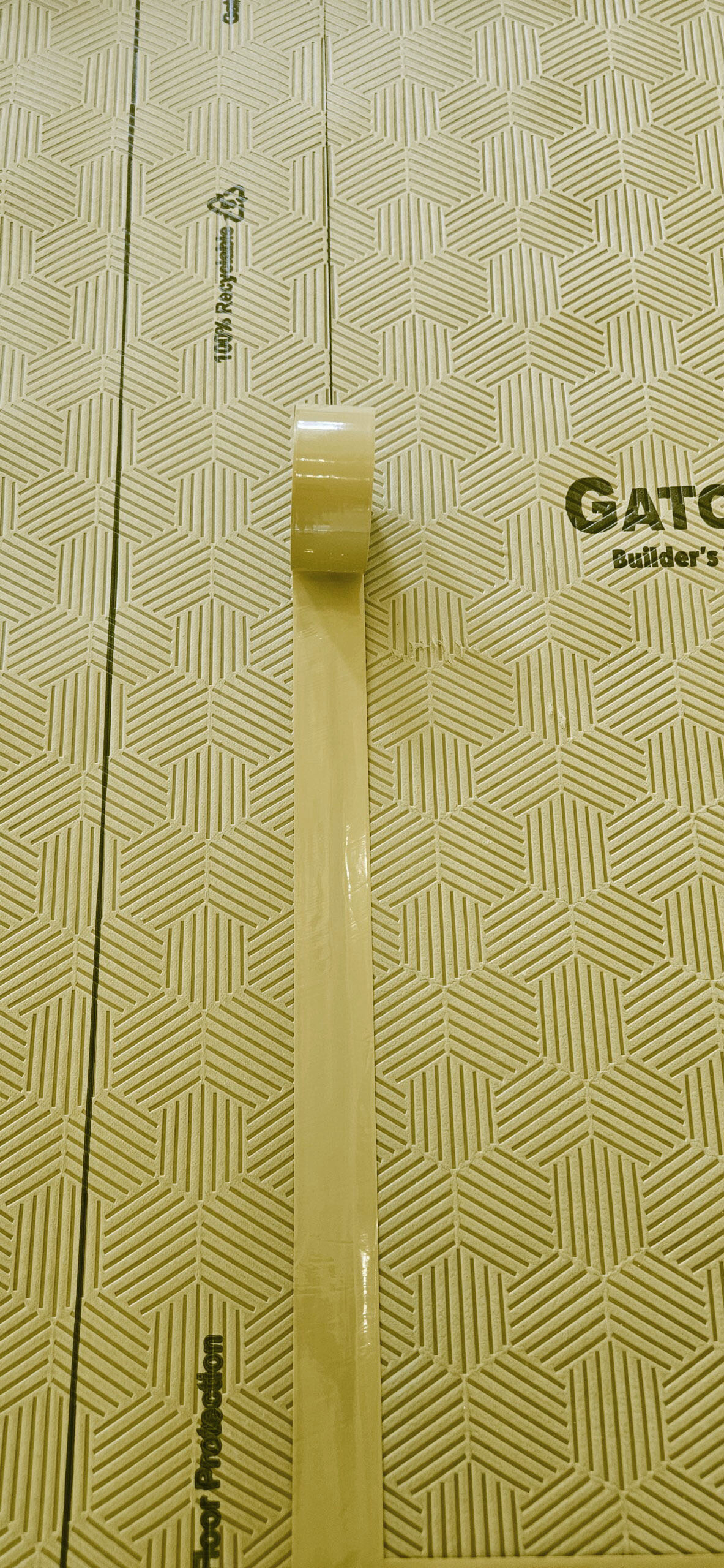floor in renovation site covered with Gator Guard protective floor covering
